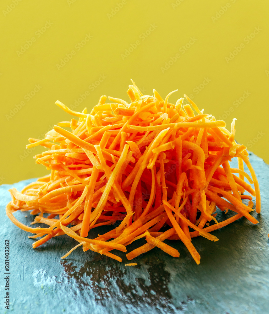 Carrot salad surrounded by yellow background Carrot salad surrounded by yellow background
