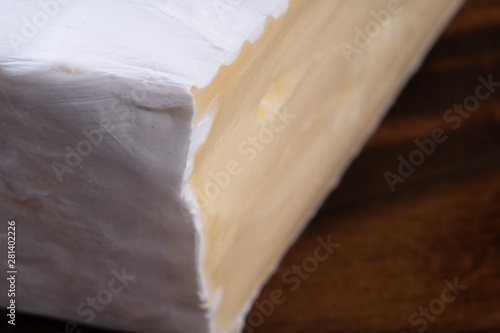 Wallpaper Mural Sliced smelly camembert cheese on a wooden rustic table Torontodigital.ca