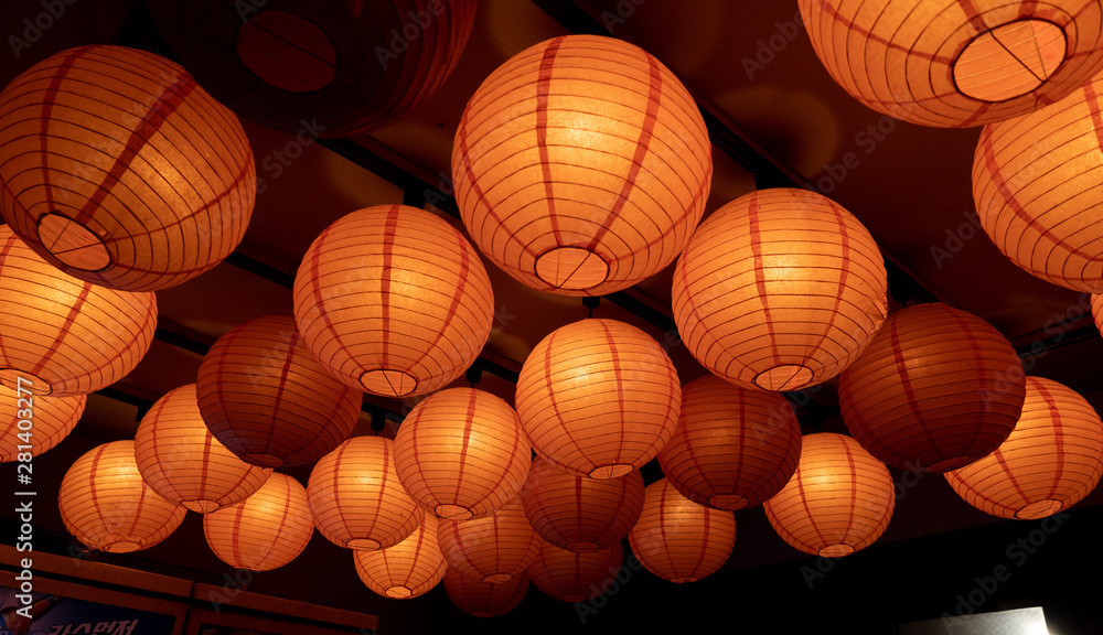 a round, bright orange lantern a round, bright orange lantern