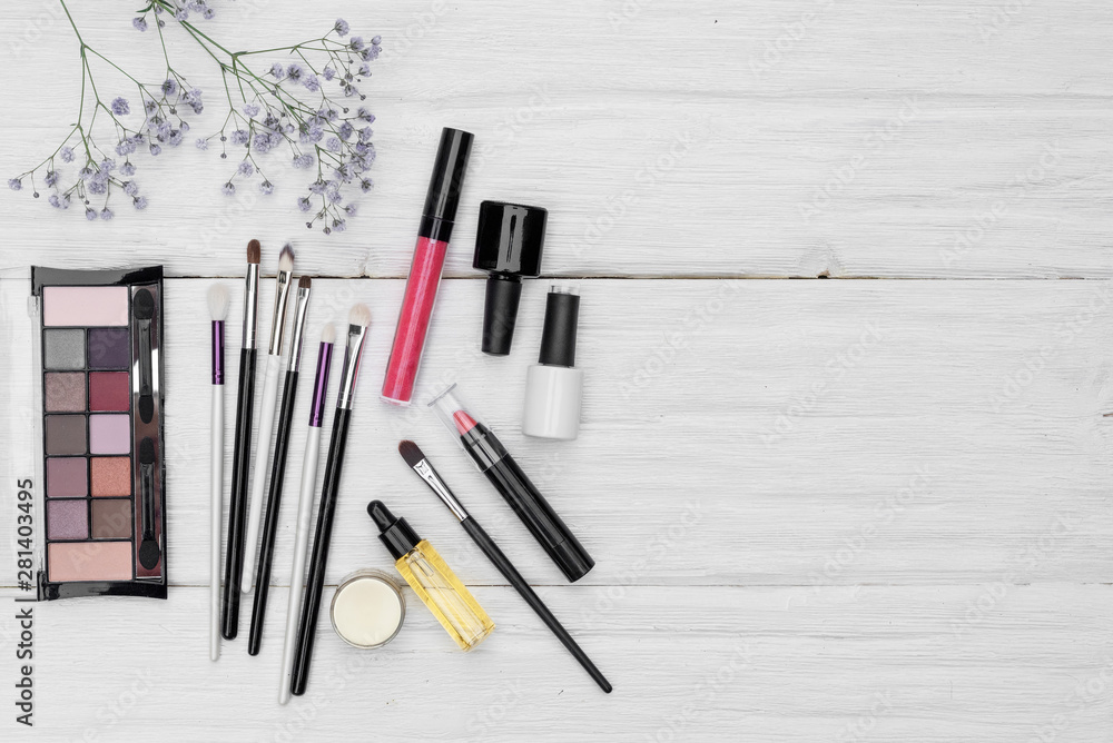 Various makeup cosmetics flat lay background with a copy space. Various makeup cosmetics flat lay background with a copy space.