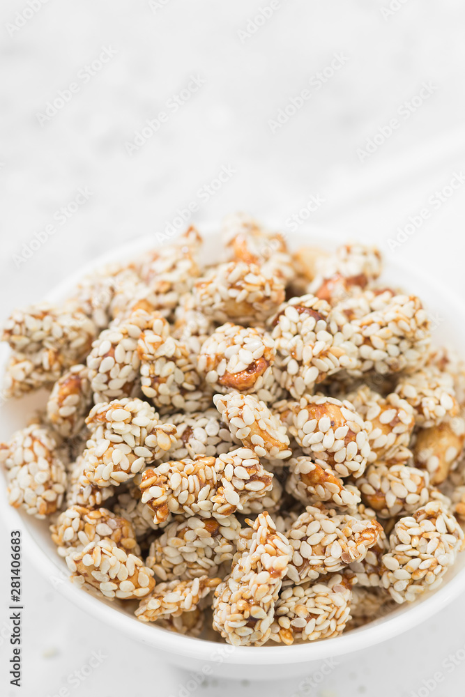 Peanuts roasted in honey and sesame seeds. Rustic style Peanuts roasted in honey and sesame seeds. Rustic style