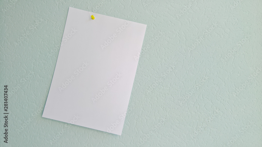 White blank sheet of paper pinned to a wall. White blank sheet of paper pinned to a wall.