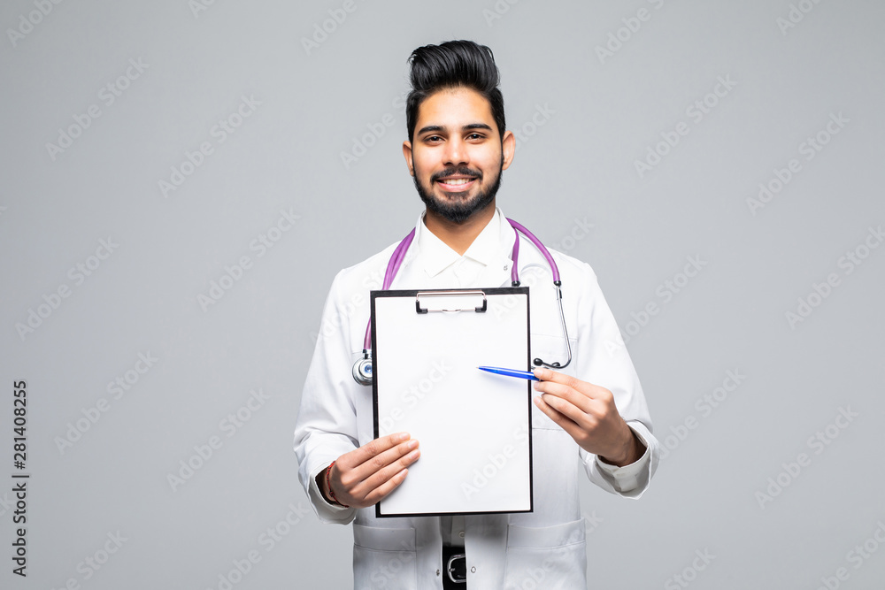 Closeup portrait of handsome indian male health care professional or doctor or nurse holding clipboard up and showing space for text, isolated on white background with copy space Closeup portrait of handsome indian male health care professional or doctor or nurse holding clipboard up and showing space for text, isolated on white background with copy space
