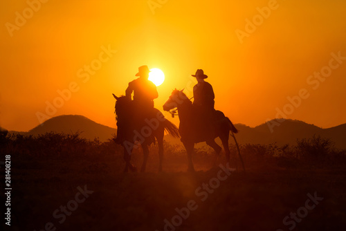                                                                                                   1466408231 Cowboys are riding horses silhouette in sunset with mountain scene in Pakchong  Nakhonratchasima  Thailand