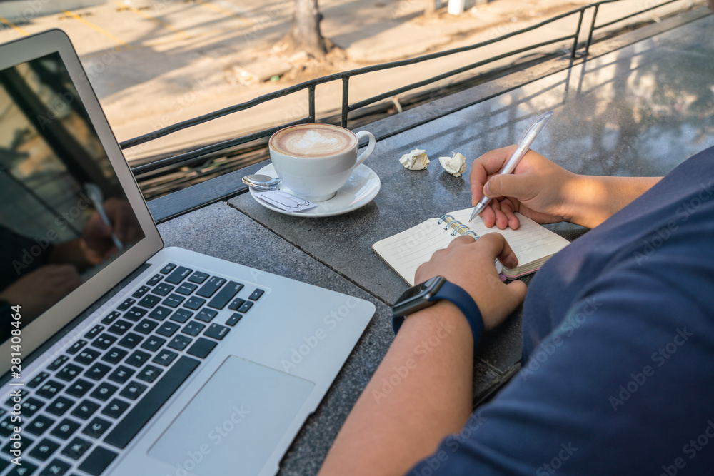 Fototapeta premium Asian human hand holding pen and writing diary notebook