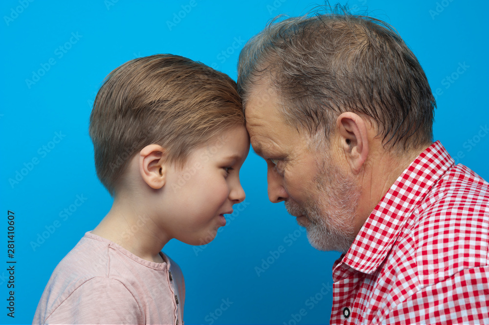 Close-up grandfather and grandson closely look Close-up grandfather and grandson closely look