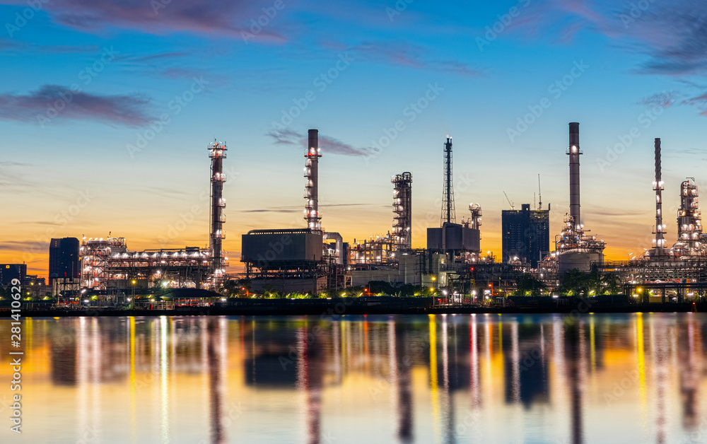 Oil and gas refinery industry plant with glitter lighting and sunrise in the morning, Factory of petroleum industrial, Power plant,Energy power station area. Industry 4.0
