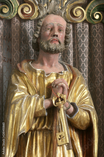 Saint Peter, statue on the main altar in the Church of Saint Mary Magdalene in Cazma, Croatia photo