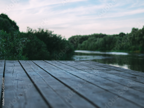 Wooden bridge on the banks of the river background