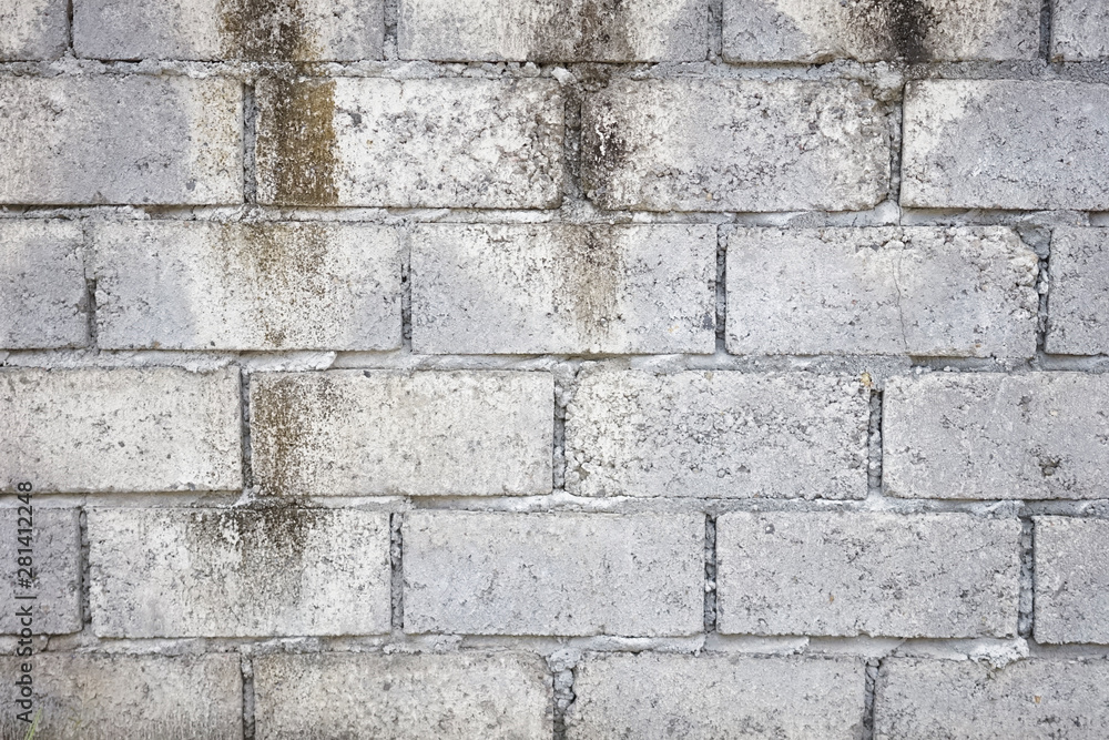 Abstract weathered textured grey brick wall background Abstract weathered textured grey brick wall background