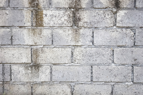 Abstract weathered textured grey brick wall background