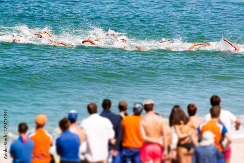 Quadro em tela triathetes in swimming race in triathlon  competition in beach