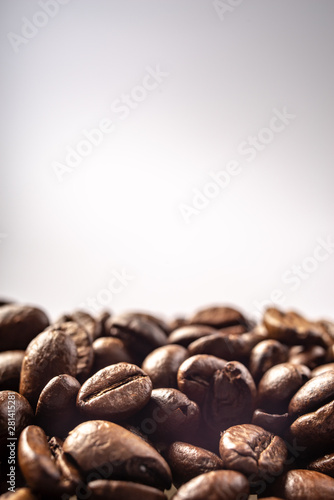 Coffee Beans Background. Close Up fresh roasted brown