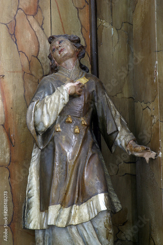 Saint Lawrence of Rome statue on the altar of Saint Anthony of Padua in the All Saints Church in the Bedenica, Croatia