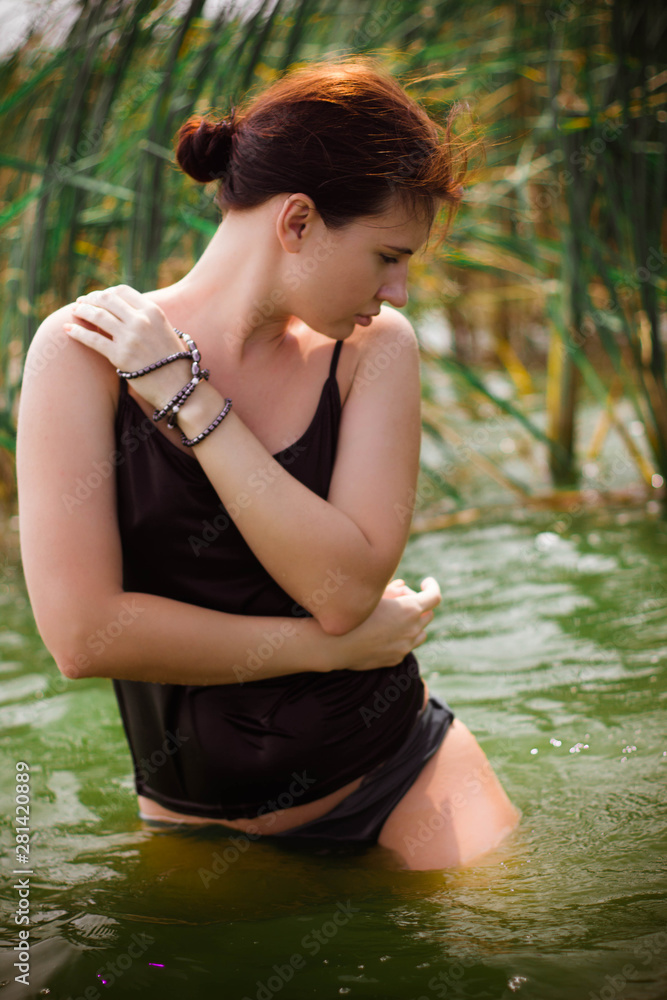 Fototapeta premium young woman in the water