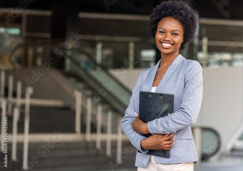 Female African American job seeker keeping a folder with CV photo