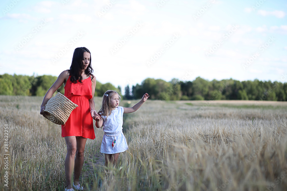 Summer landscape and a girl on nature walk in the countryside.