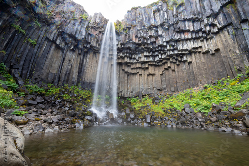 Svartifoss (Black Falls) is a waterfall with basalt columns in Skaftafell. Vatnajökull National Park in Iceland.