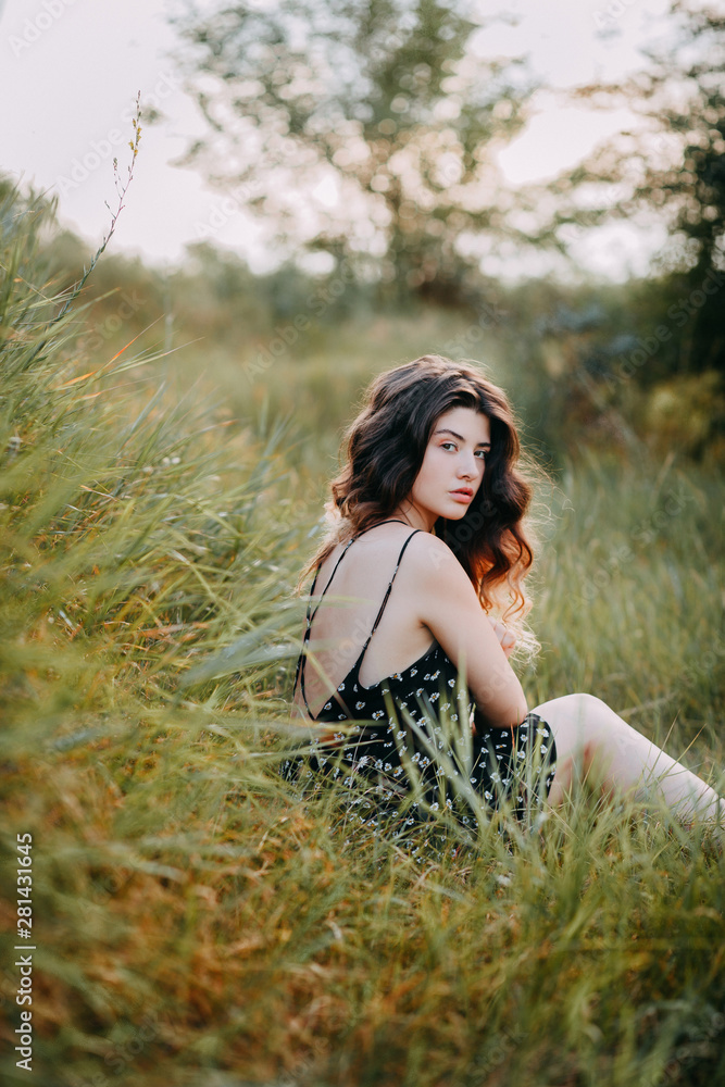 Young girl in harmony in the summer nature Young girl in harmony in the summer nature
