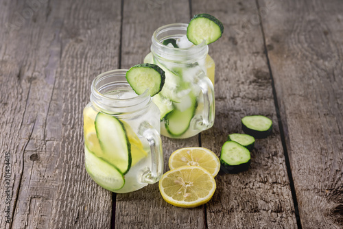Fresh Cold Water with Lemon and Cucumber Infused Water Healthy Detox Water with Lemon and Cucumber Wooden Background Horizontal Copy Space