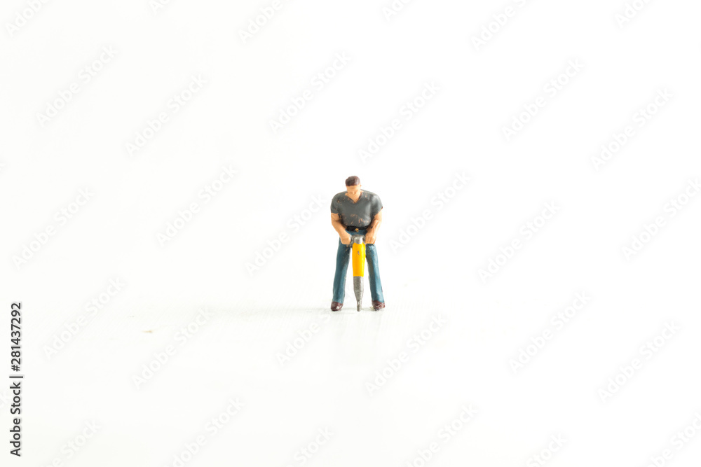 Iconic Image of a Miniature Construction Worker using a Jack Hammer/Drill Iconic Image of a Miniature Construction Worker using a Jack Hammer/Drill
