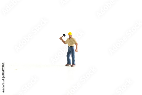 Iconic Image of a Miniature Construction Worker using a Hammer