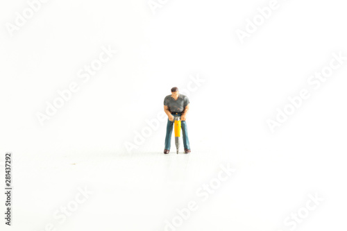 Iconic Image of a Miniature Construction Worker using a Jack Hammer/Drill