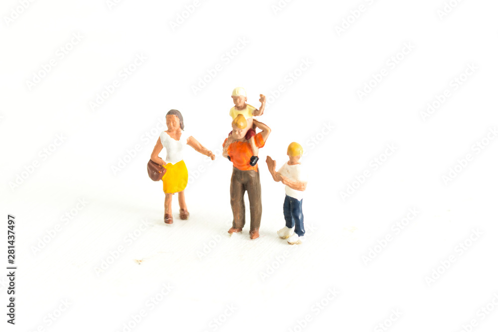 Iconic image of a Family (miniature people) standing on a white isolated background Iconic image of a Family (miniature people) standing on a white isolated background