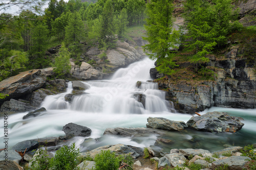 Lillaz waterfall among rocks, Aosta Valley, Alps of Italy