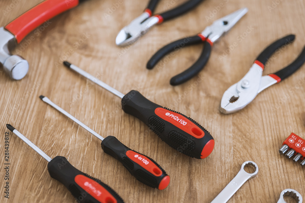 Construction tools on the wooden background. Construction tools on the wooden background.