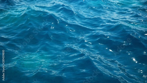 Sea or ocean, waves close-up view. Blue waves sea water. Blue crystal clear water. One can see the sandy seabed. Sea wave low angle view. 3D 4K animation