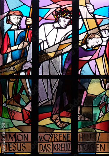 5th Stations of the Cross, Simon of Cyrene carries the cross, stained glass window in Saint Lawrence church in Kleinostheim, Germany  © zatletic