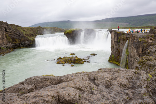 Iceland landscape scenic view of Godafoss waterfall against cloudy sky. It is one of the famous tourist attractions. It is a spectacular Icelandic waterfall on the North of island