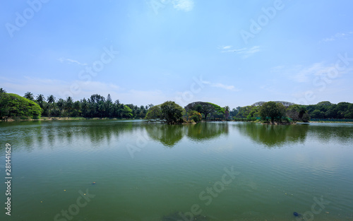 Beautiful view of lake in Lal Bagh Botanical Garden, one of the tourist attractions in Bangalore, with plenty variety of trees, Bengaluru, Karnataka, India