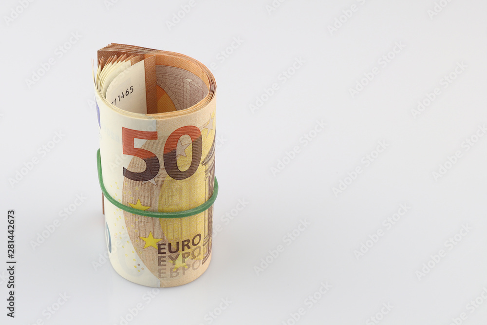 Roll of fifty euro banknotes with a rubber band, isolated background