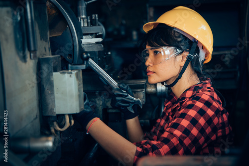 Asian beuatiful woman working with machine in the factory engineer and working woman concept or woman day