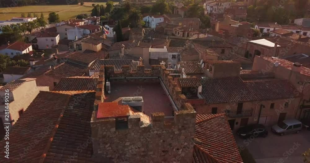 Top view of the medieval European city: tiled roofs, green field, sea. Top view of the medieval European city: tiled roofs, green field, sea.