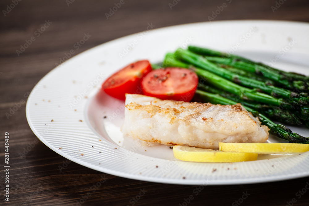 Fish dish - fried fish fillet and vegetables Fish dish - fried fish fillet and vegetables