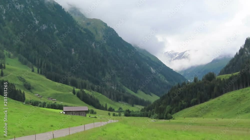 Hiking trail through Schoenachtal valley at Zillertal valley. Wooden barn and farmland around. Hiking trail through Schoenachtal valley at Zillertal valley. Wooden barn and farmland around.