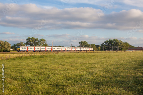 Commuter train in the fields