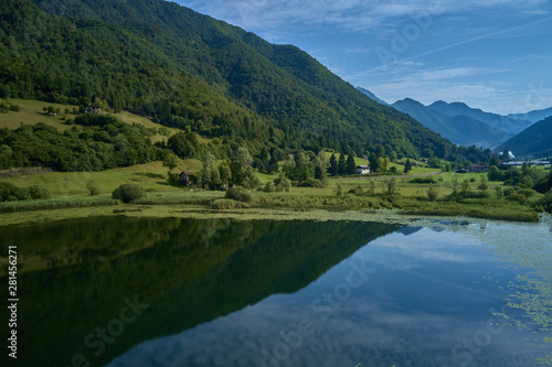 Aerial photography. Panoramic view of a small lake north of Italy. Trento region. Great trip to the lake in the Alps.
