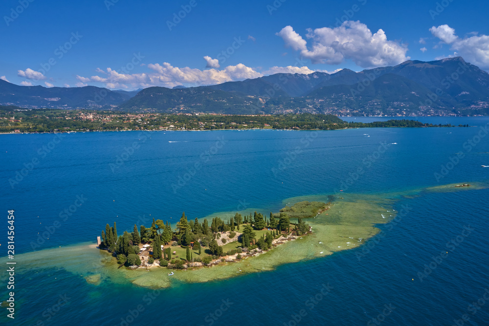 Obraz premium Unique view of the island of San Biagio. In the background is the Alps. Resort place on Lake Garda north of Italy. Aerial photography.