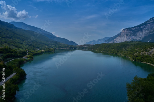 Fototapeta Naklejka Na Ścianę i Meble -  Aerial photography. Panoramic view of a small lake north of Italy. Trento region. Great trip to the lake in the Alps.