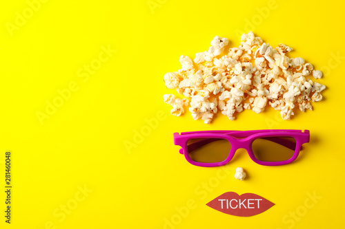 Foto Flat lay composition with movie watching accessories on yellow background, top v