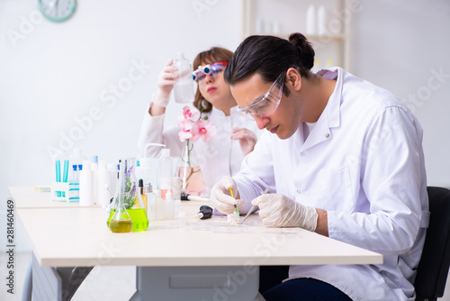 Two chemists working in the lab