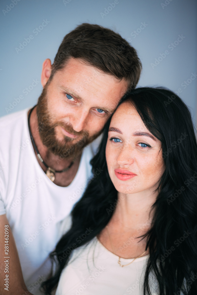 Loving couple woman and man with beard soft light from window Loving couple woman and man with beard soft light from window