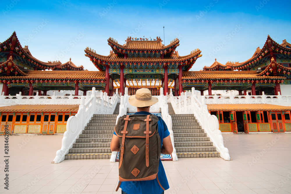 Naklejka premium Man backpacker tourist is visiting Thean Hou Temple in Kuala Lumpur, Malaysia.