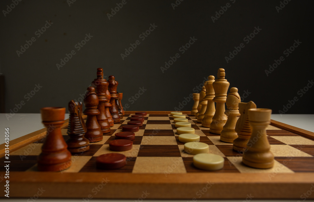 Chess placed on a wooden table,concept : of business strategy and tactic battle,symbol competition game success play victory war Chess placed on a wooden table,concept : of business strategy and tactic battle,symbol competition game success play victory war