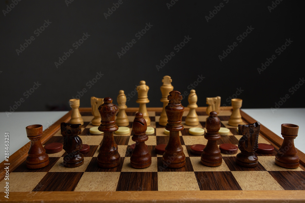 Chess placed on a wooden table,concept : of business strategy and tactic battle,symbol competition game success play victory war Chess placed on a wooden table,concept : of business strategy and tactic battle,symbol competition game success play victory war