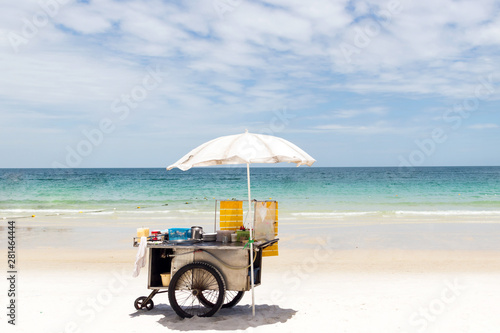 Photography Cart selling roti snack on the beautiful beach in sunny day; popular street snac